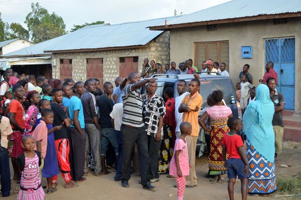 Members of the public at Junda area in Mishomoroni, Mombasa County where two terror suspects were shot dead by police on July 21, 2016.