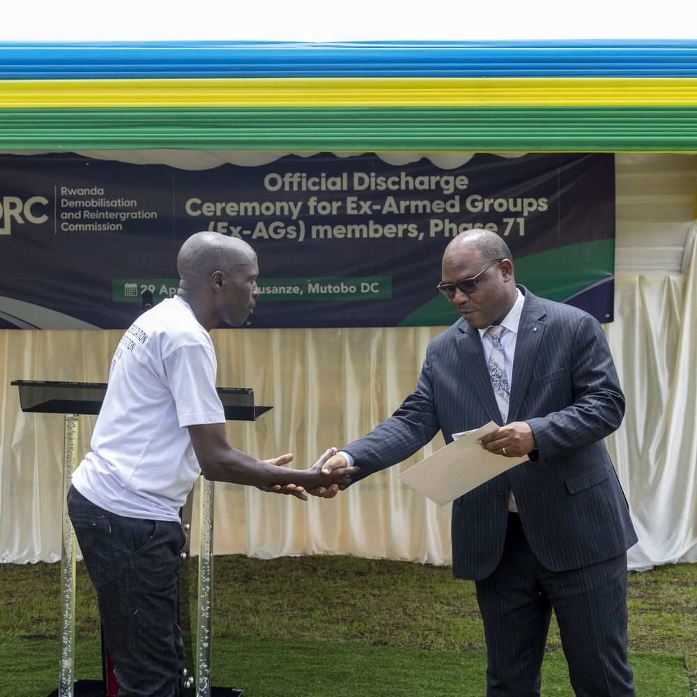 Col Uwimana receiving his certificate of completion.