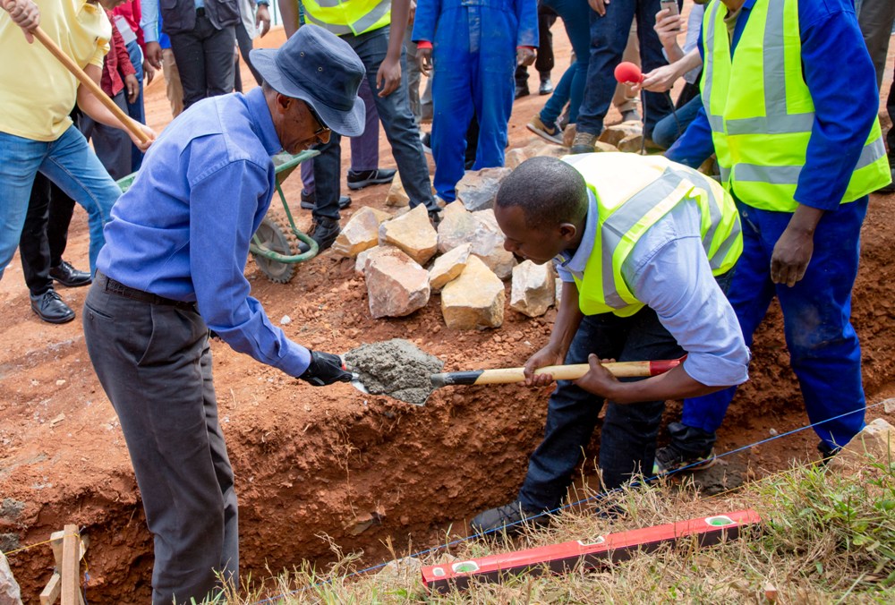 President Paul Kagame participating in a community work exercise.