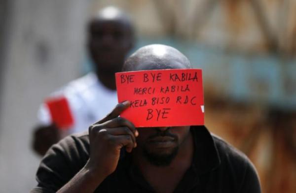 A Congolese opposition party supporter displays a red card against President Joseph Kabila in Kinshasa, Democratic Republic of Congo December 19, 2016.