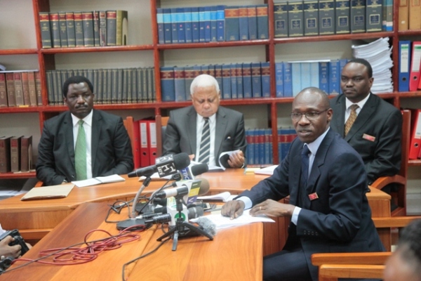 High Court Registrar, Mr Ilvin Mgeta, speaks at news conference in Dares Salaam yesterday,on the sacking of 34 judicial officers, including magistrates from different levels for misconduct.Centre is the Chief Justice, Mohamed Chande Othman, Principla Judge, Ferdinand Wambali (left) and Court of Appeal Registrar, John Kayoza.