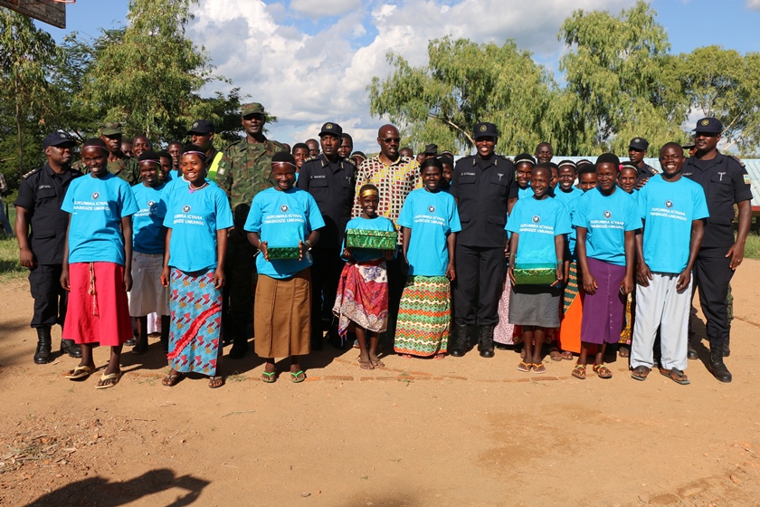 Police and local leaders joined by members of Garuka Urebe cultural troupe.