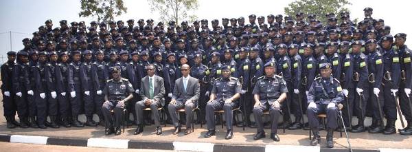 Minister of Internal Security, Sheikh Musa Fazil Harerimana, Minister of Defense Gen James kabarebe, Inspector General of Police (IGP) Emmanuel K Gasana and other senior officers pose for a group photo with the newly commissioned cadet officers intake 08.