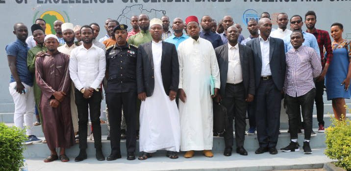 Officials and participants pause in a group photo after the meeting.