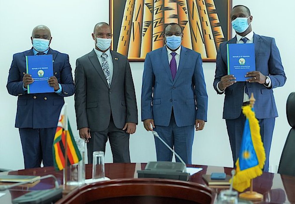 Officials pose for a group photo after the signing ceremony. 