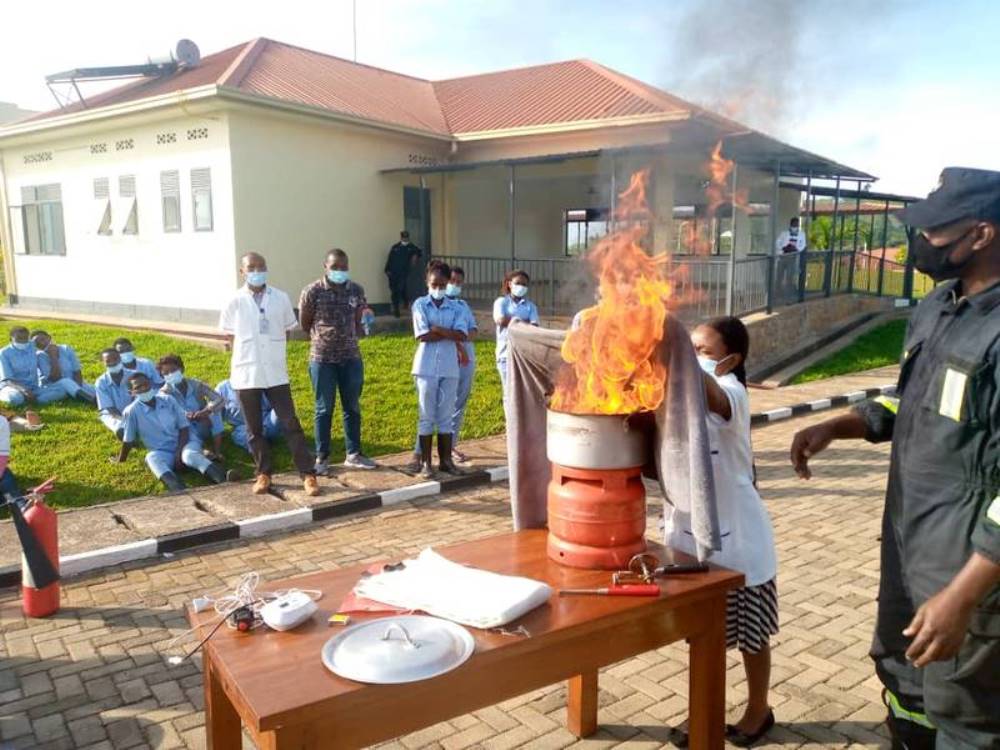 Trainees conducting fire drills to extinguish burning substances.  
