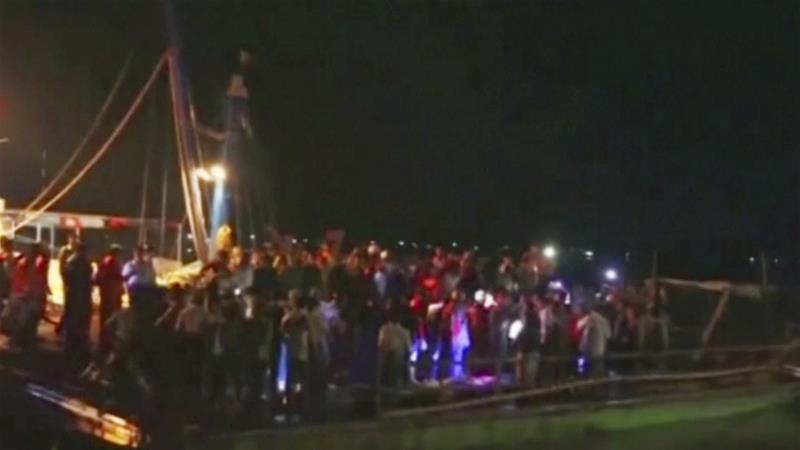 Photos in local media showed rescuers working in the darkness on Saturday night to lay the bodies of the dead onshore