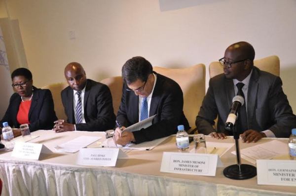 Minister Musoni and the CEO of Symbion power signing agreements