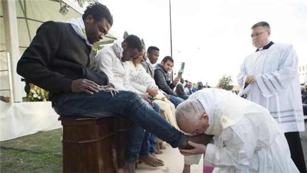 The Holy Thursday rite re-enacts the foot-washing ritual Jesus performed on his apostles