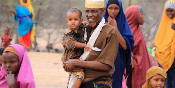Refugees wait at the Dadaab airstrip, Kenya on June 16, 2016 as they prepare for repatriation to Somalia. The UNHCR has said 24,000 refugees have so far been assisted to voluntarily return to Somalia since a tripartite agreement was signed in 2014. 