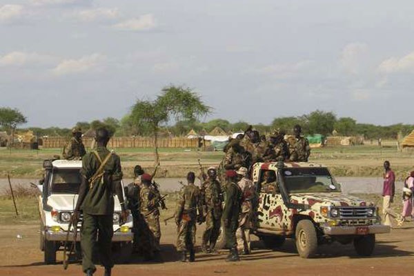 Sudan People's Liberation Army soldiers stand outside a United Nations base in Abyei May 16, 2008.