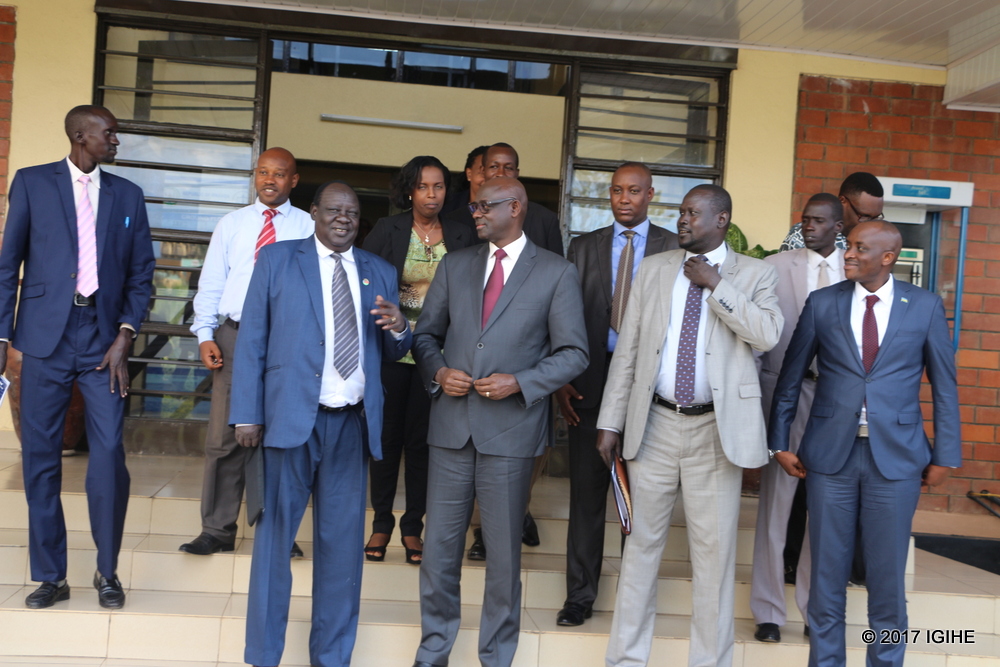 Busingye chats with delegates after the meeting