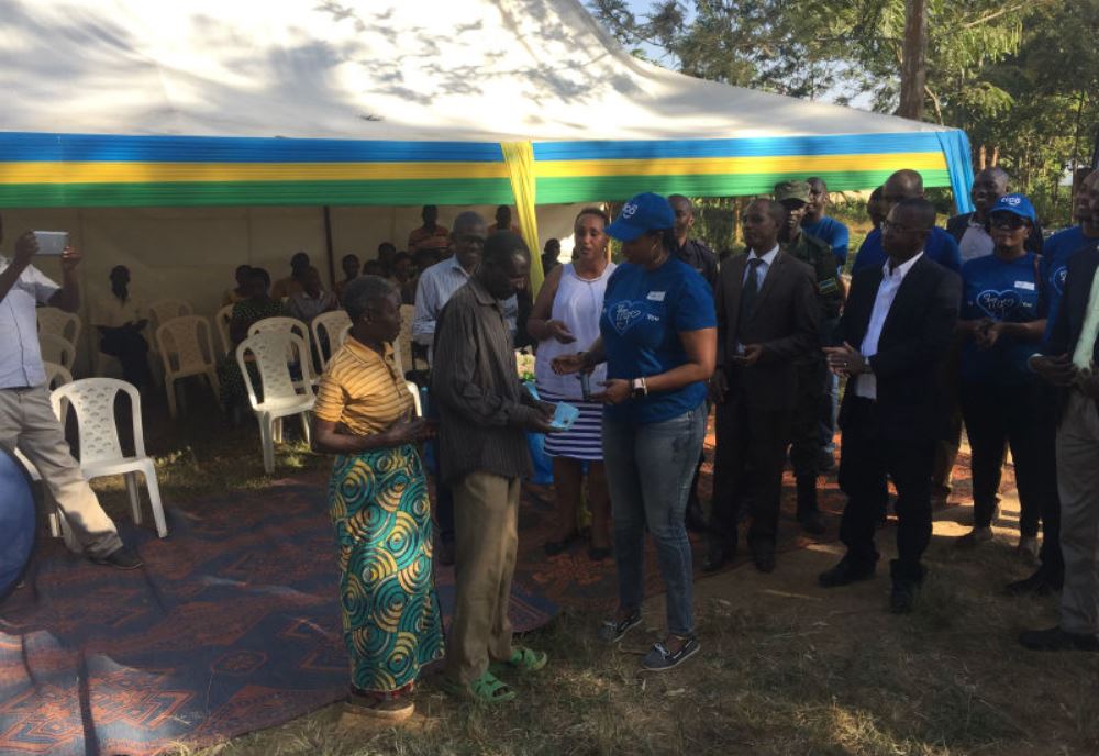 Deputy CEO Chantal Kagame hands over Mutuelle de Sante card to a beneficiary