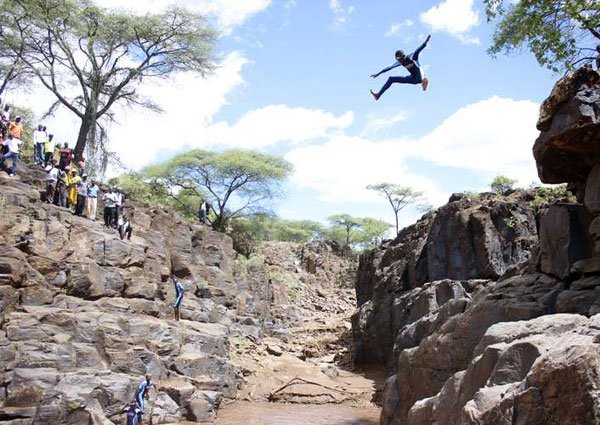 Youth dive into Cheploch Gorge on the Baringo and Elgeyo-Marakwet counties’ border on April 18, 2015. The daredevils told the Nation last week that the reptiles were usually too scared to attack because of the frequent storms.