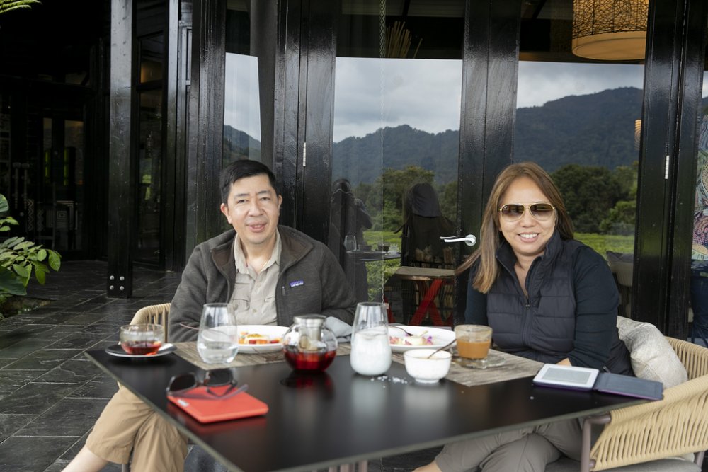 Victot Dizon and his wife smiling after exploring the beauty of Nyungwe National Park. They hail security in Rwanda