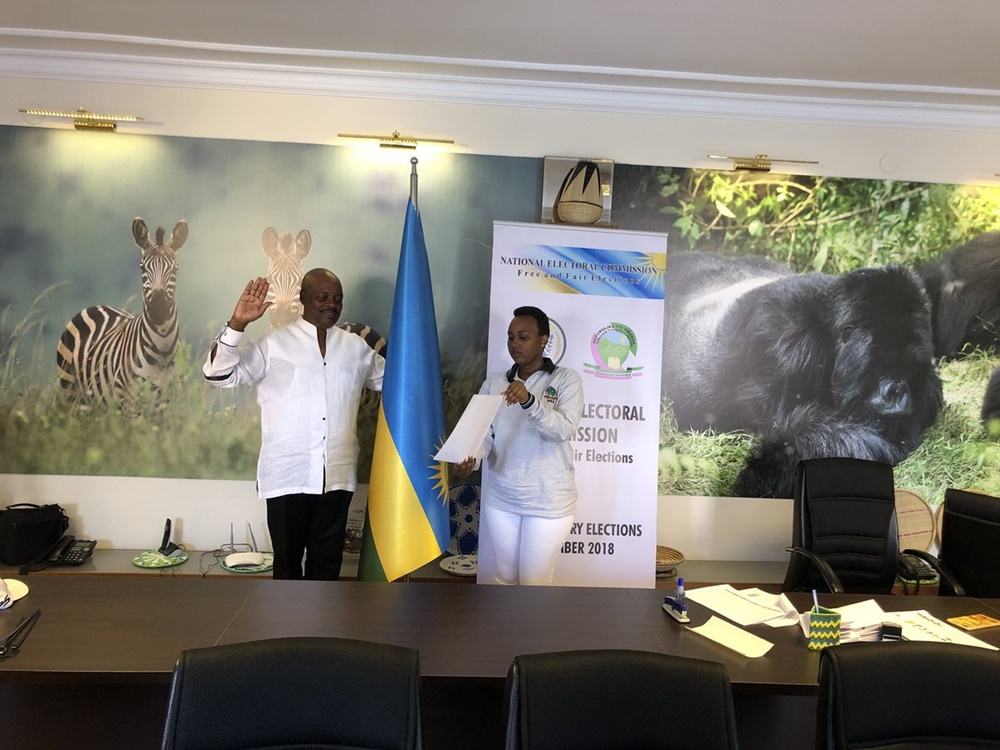 Ambassador Williams Nkurunziza swears in before presiding over the poll.