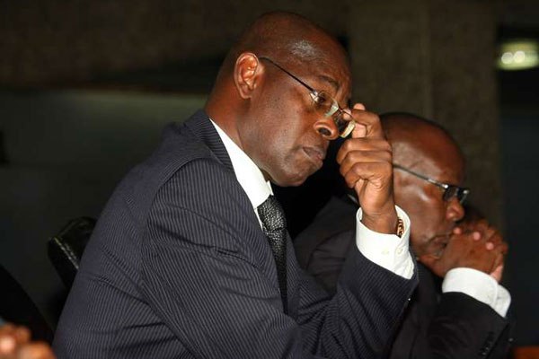 Ethics and Anti-Corruption commission chairperson Philip Kinisu (left) and Attorney General Githu Muigai at KICC in Nairobi on March 15, 2016 during the launch of the National Survey on Corruption and Ethics 2015 report.