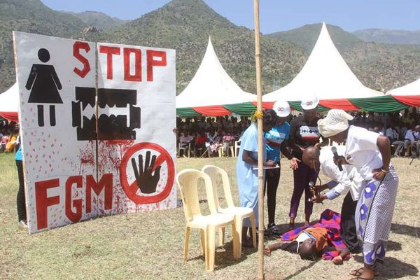 University students enact a play campaigning against female genital mutilation during the International Day of Zero Tolerance on Female Genital Mutilation at Kerio Valley Boys Secondary School in Tot, Elgeyo-Marakwet County.