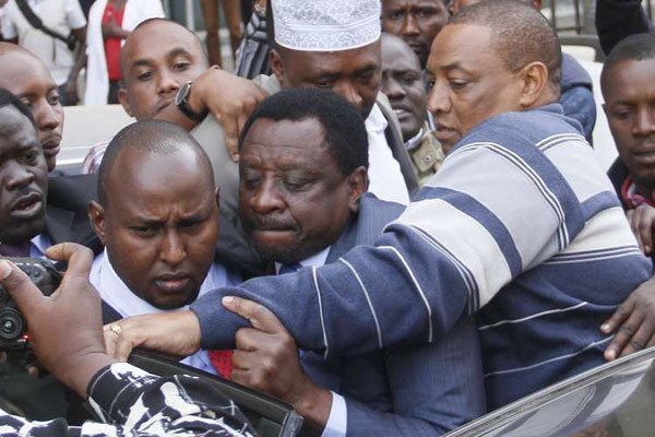 Suna East Member of Parliament Mr Junet Mohamed (right) and Senator James Orengo centre board a police vehicle after the arrest of Mohamed at Nation Centre on June 14, 2016.