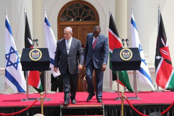 Israeli Prime Minister Benjamin Netanyahu (left) walks with President Uhuru Kenyatta at the State House in Nairobi on July 5, 2016, on the second leg of his tour of sub-Saharan Africa.