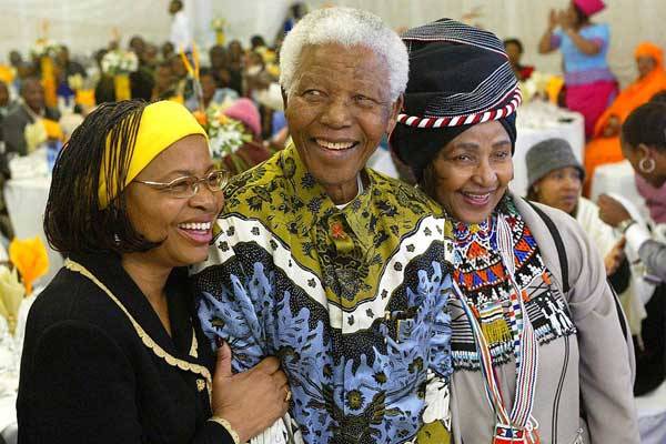 Former South African President Nelson Mandela celebrates his 86th birthday with his wife Graca Machel ( L ) and ex -wife Winnie Madikizela Mandela ( R ) in his rural home town of Qunu in the Eastern Cape Province on 18 July 2004. Nelson Mandela's widow Graca Machel has given up her right to half his more than $4-million estate, an executor of his will said Tuesday.