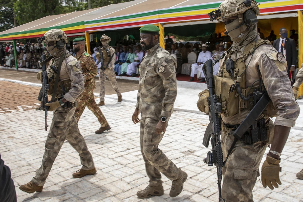 Leader of Mali’s ruling junta Lt. Col. Assimi Goita, center, attends an independence day military parade in Bamako, Mali on September 22, 2022.