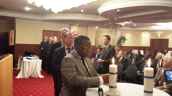 DRC Minister of labour ,Bahati Lukwebo, lighing the flame at the launch of Kwibuka20 in Kinshasa.