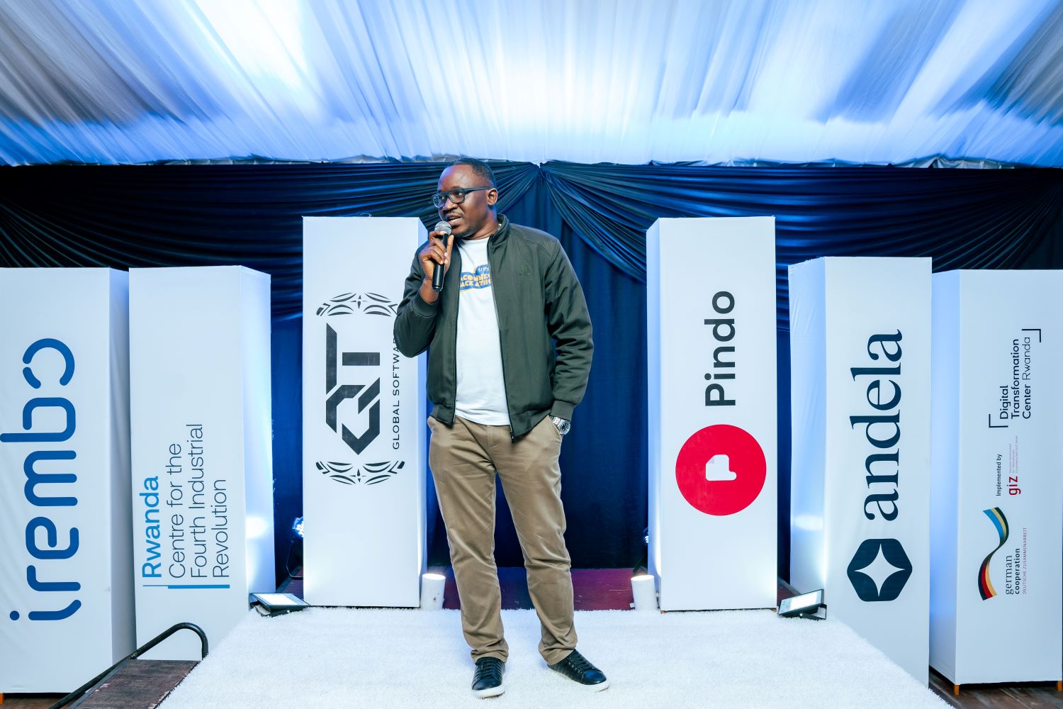 Peter Charles Djomga, Director of Software Engineering at Irembo, makes his remarks during the awarding ceremony.