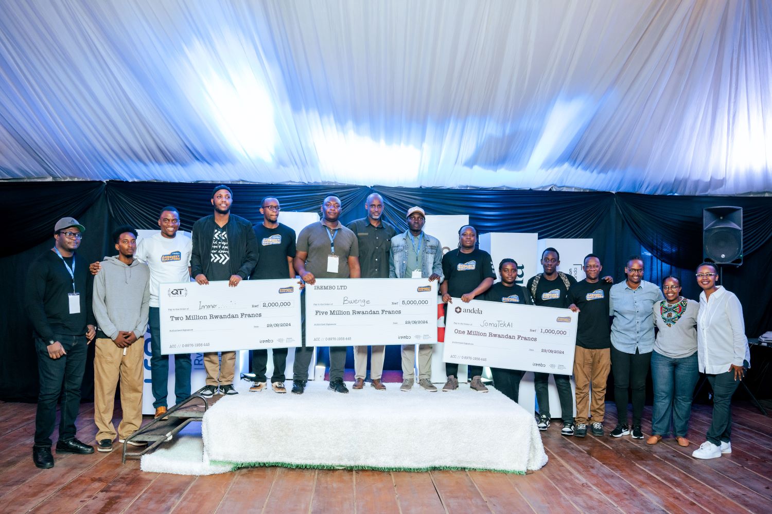 The winning teams pose for a photo with some of the judges of the competition.