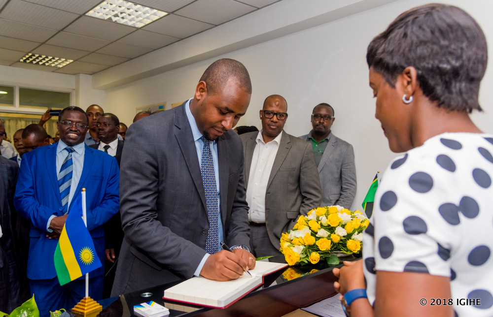 State Minister in charge of Transportation in the Ministry of Infrastructure, Jean de Dieu Uwihanganye signs int the book of guests