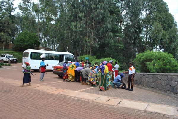 Caretakers getting ready to enter Butaro Hospital after admission.