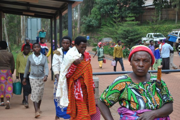Caretakers entering through Butaro Hospital gates.