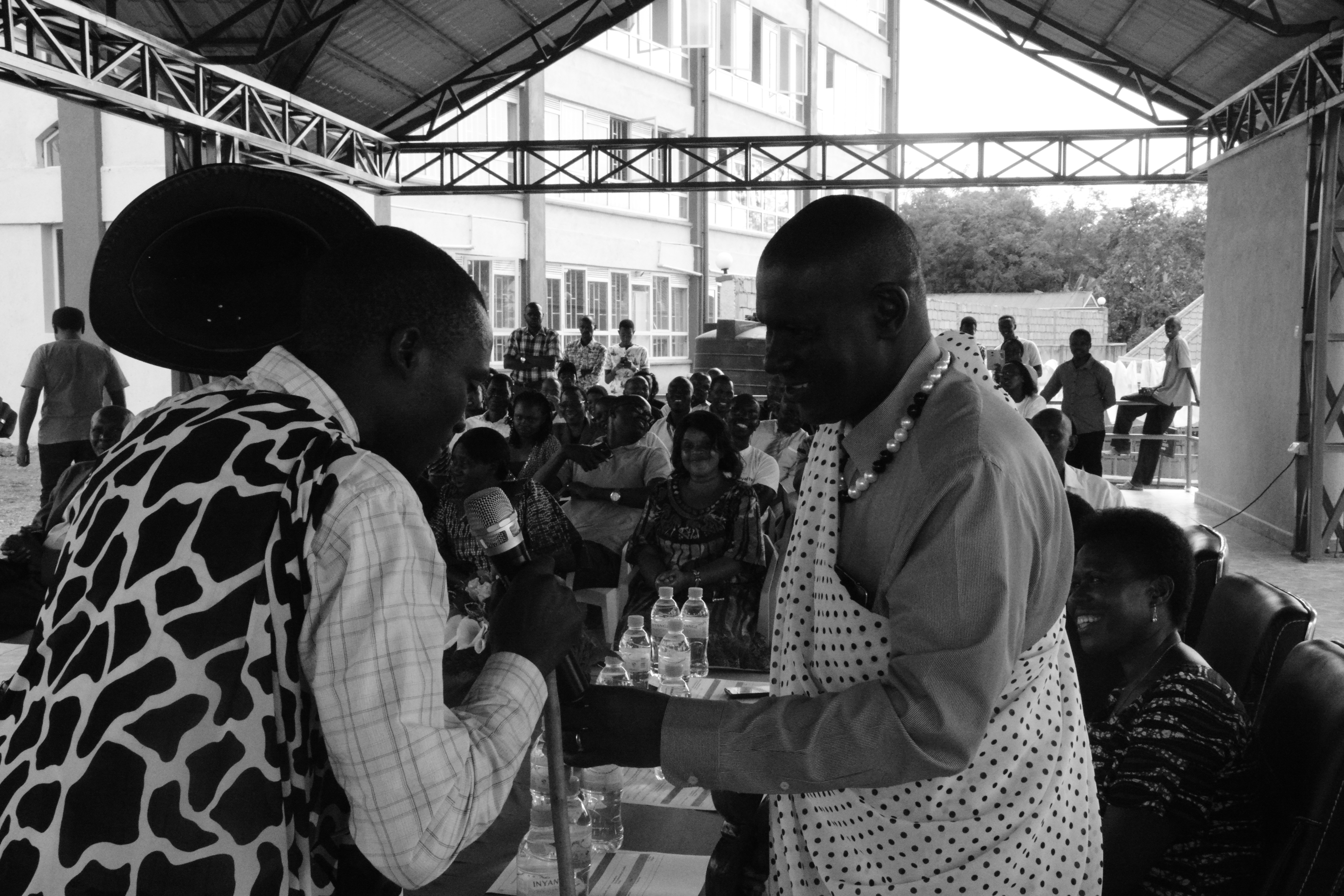 The Vice Chancellor, Prof Edwin Odhuno being taken through the Rwandan tradition of cow giving.