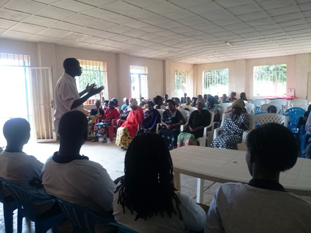 Albert Musabyimana, The Founder of Peace and Hope speaking to elders and orphans who play the parental role