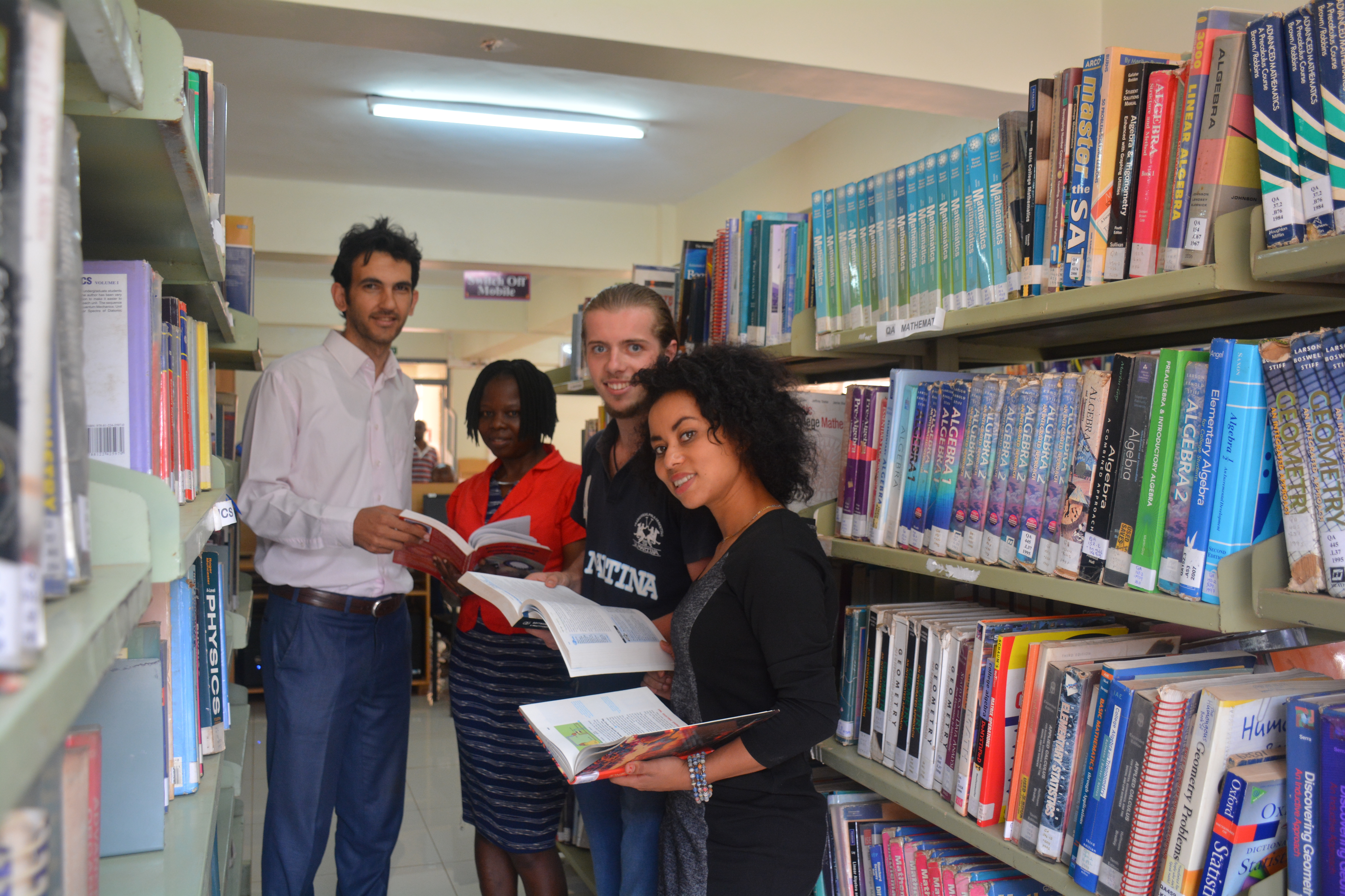 Mku international  students share a moment at the Mwalimu Peter Clavers library renown for its excellent e-learning facilities
