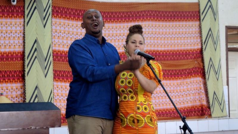 Jean Claude Nkulikiyimfura (left), the executive director of Agahozo Shalom Youth Village, goofs around during a music show for the students on February 17, 2017. (Melanie Lidman/Times of Israel)