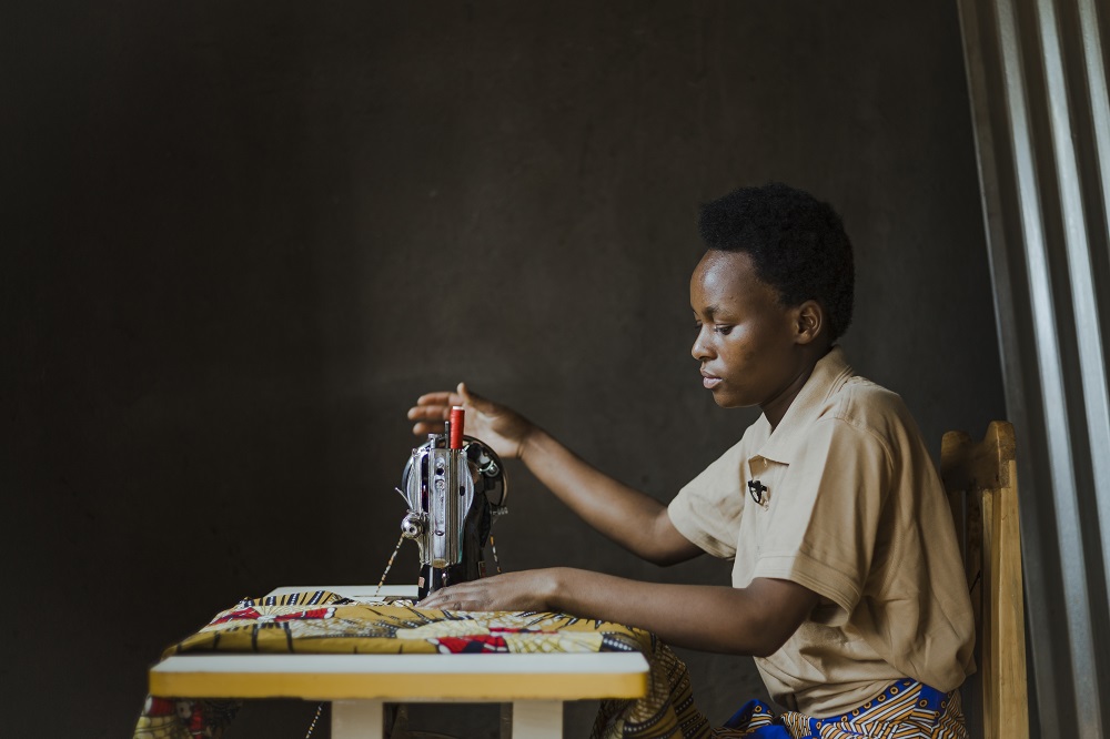 Dushimirimana using her sewing machine. 
