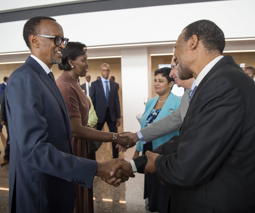 This dinner between the president and several diplomats was held in Kigali Convention Centre. Here, President Kagame was greeting South-Africa's Ambassador in Rwanda, George Nkosinati Twala