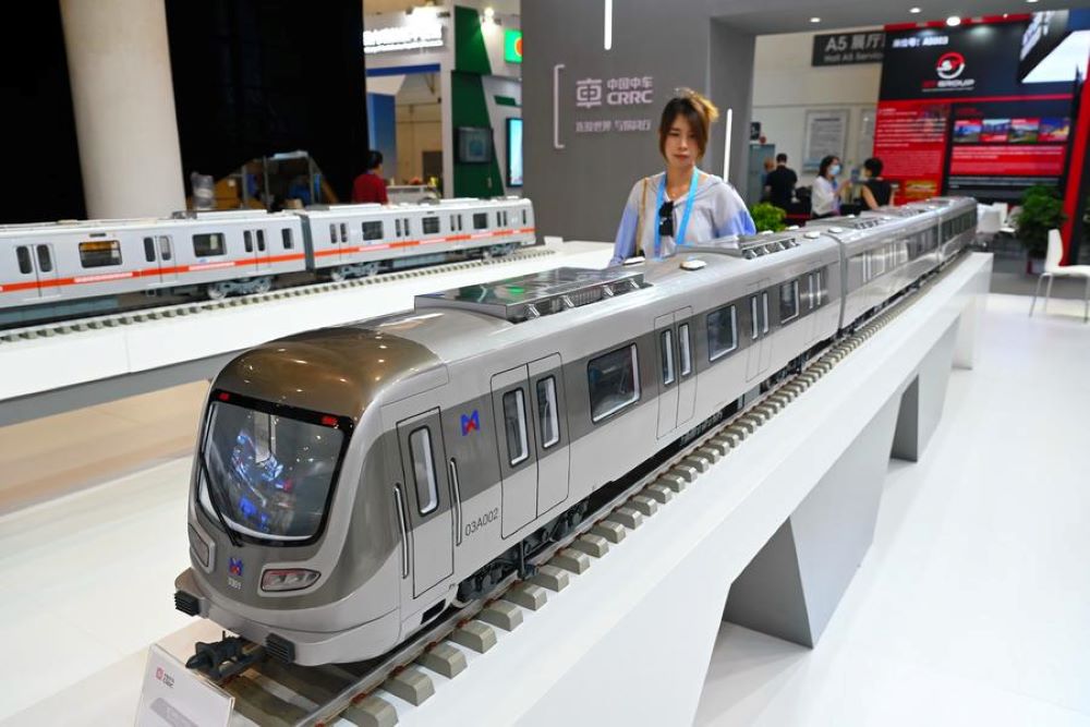 A visitor views a model of Xiamen Metro train at the exhibition of BRICS New Industrial Revolution 2024 in Xiamen, southeast China's Fujian Province, Sept. 10, 2024. (Xinhua/Lin Shanchuan)