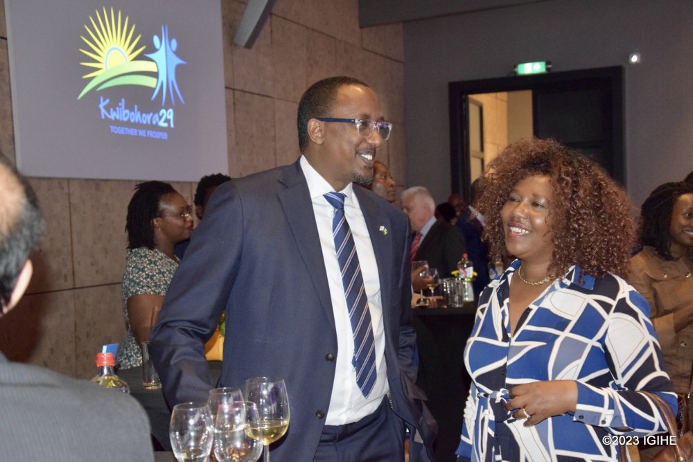 Michel Minega Sebera , Minister Counsellor at Rwanda's Embassy in the Netherlands interacting with a participant of the event. 