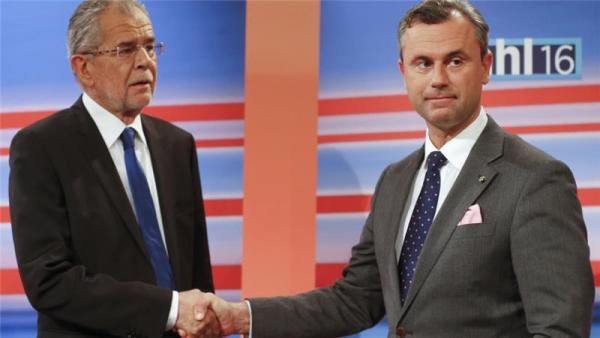 Hofer, right, of the Freedom Party, conceded defeat to Van der Bellen, left, on a Facebook post on Monday