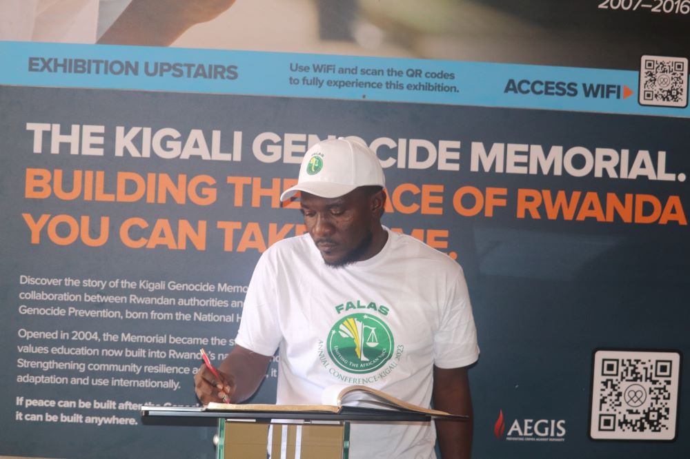 FALAS President signing the guest book at Kigali Genocide Memorial. 