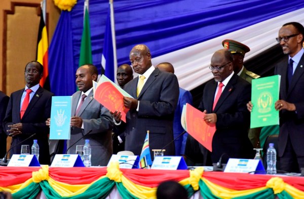 President Yoweri Kaguta Museveni looks through the dammy E- copy of the East African passport together with other East African Heads of State during the 17th Summit of the EAC on Wednesdsay 2nd March 2016.