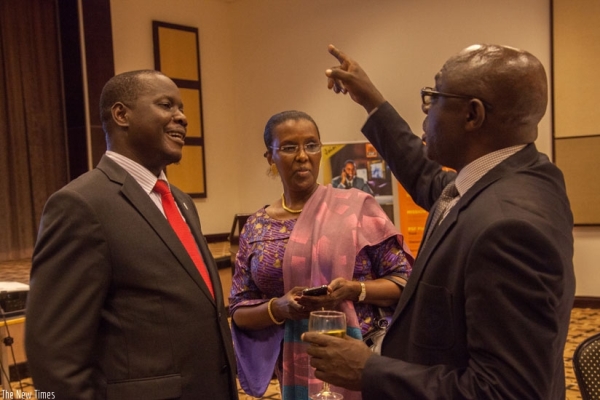 Hon. Daniel Fred Kidega (L), Speaker of the East African Legislative Assembly, Amb. Valentine Rugwabiza (C), Minister for East African Affairs, and Denis Karera, Chairman of the East African Business Council, share a light moment during a dinner at Serena Hotel recently.
