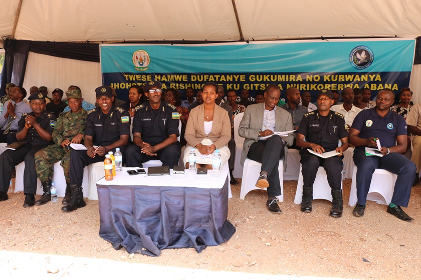 Governor Kazayire, Senior Police officers and residents follow proceedings during the event in Rwinkwavu.