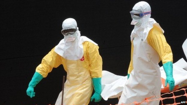 Doctors prepare to take Blood sample from body of suspected Ebola victim at Kenyatta National Hospital