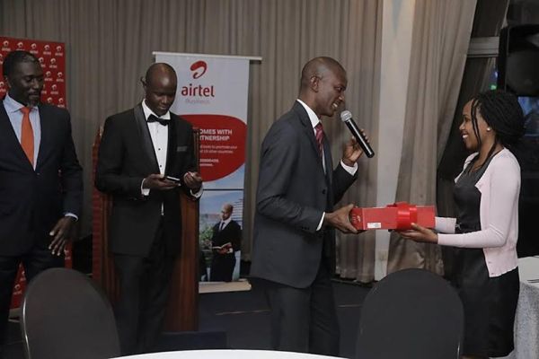 Airtel Rwanda Managing Director, Mr Michael Adjei awards one of the lucky winners with an Airtel Enterprise solutions package