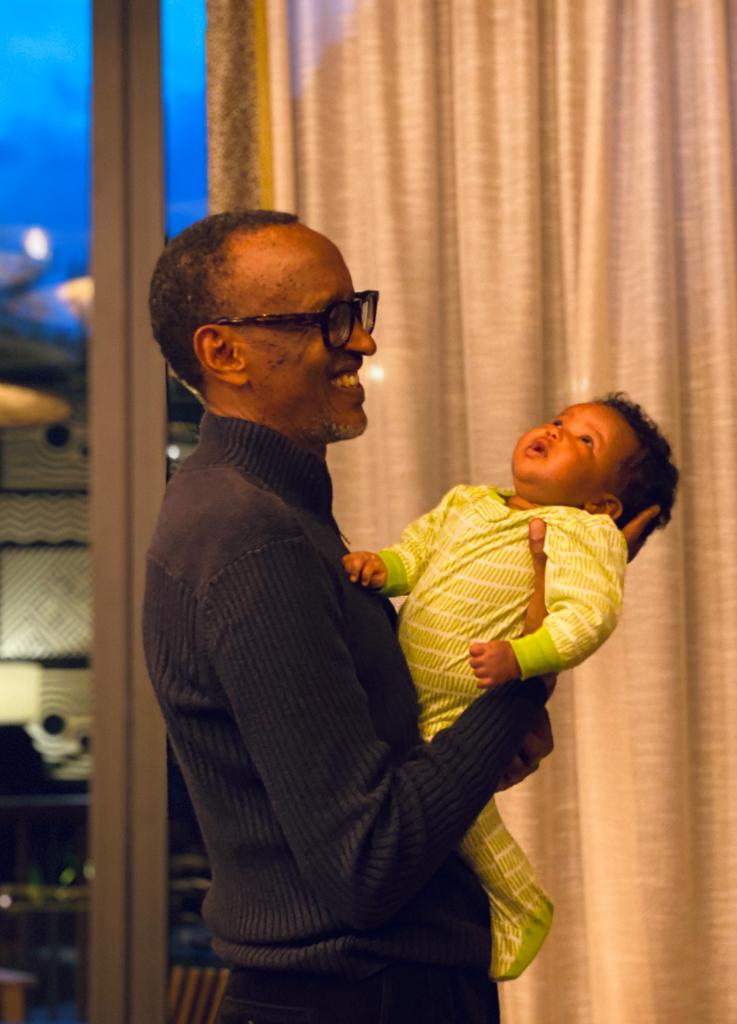 President Paul Kagame was filled with delight as he was photographed carrying his granddaughter in a photo that he, for the first time shared with the public.