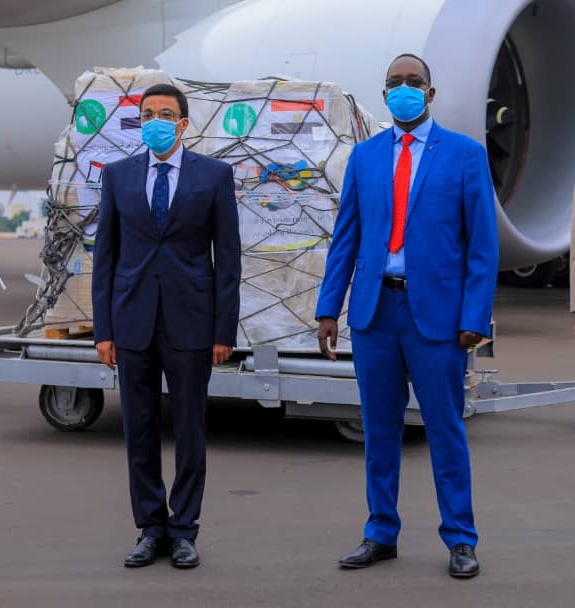 Egypt's ambassador to Rwanda, Ahmed El Ansary standing with the Minister of Health Dr. Ngamije Daniel