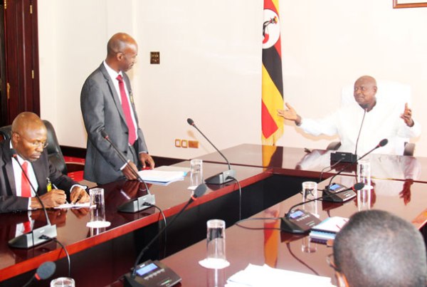 President-elect Yoweri museveni receives a petition from Mr Amama Mbabazi’s lawyers Michael Akampurir and Severino Twinobusingye at State House Entebbe yesterday.